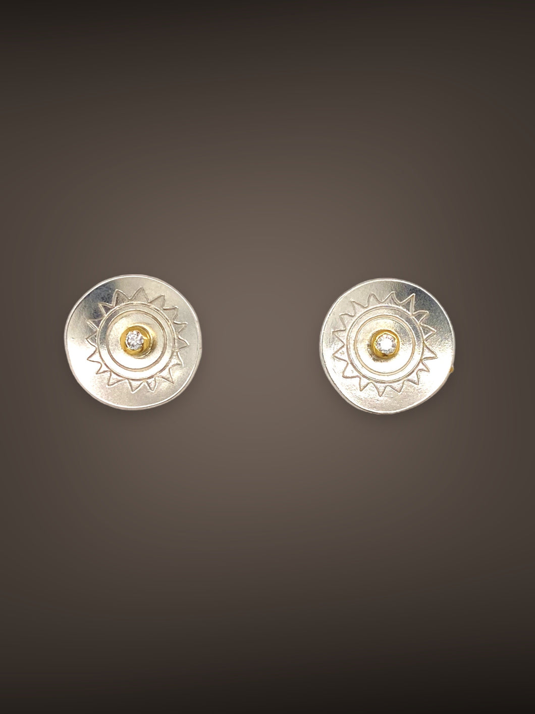 Sterling silver studs with sun design and .04ct diamonds set in 18k bezels